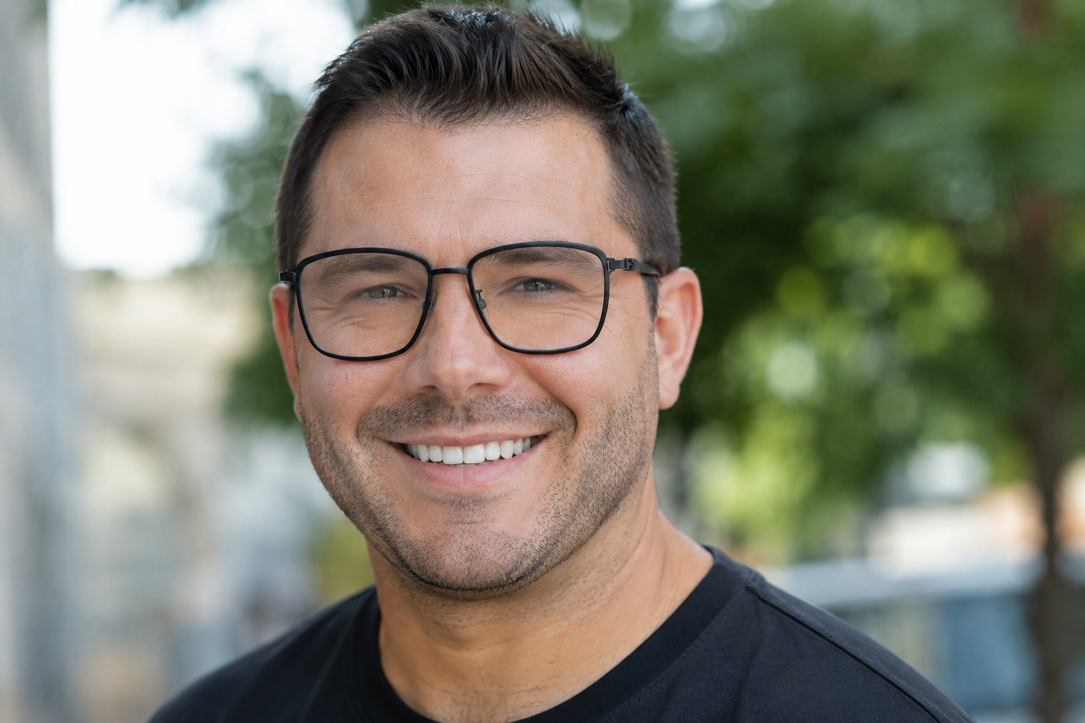 man wearing oversized black titanium rectangle glasses