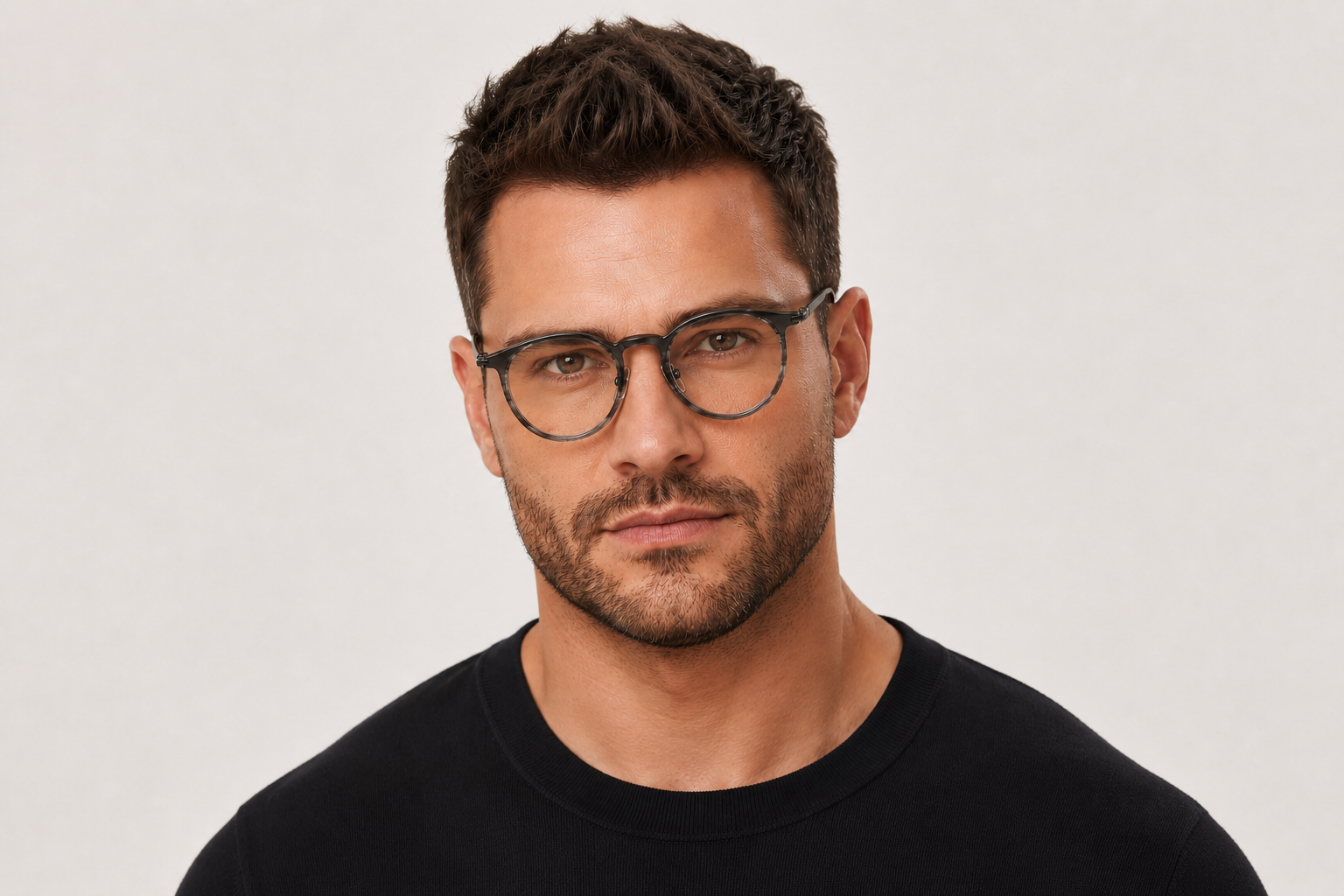 man wearing 163mm grey tortoiseshell lightweight titanium wide-fit glasses